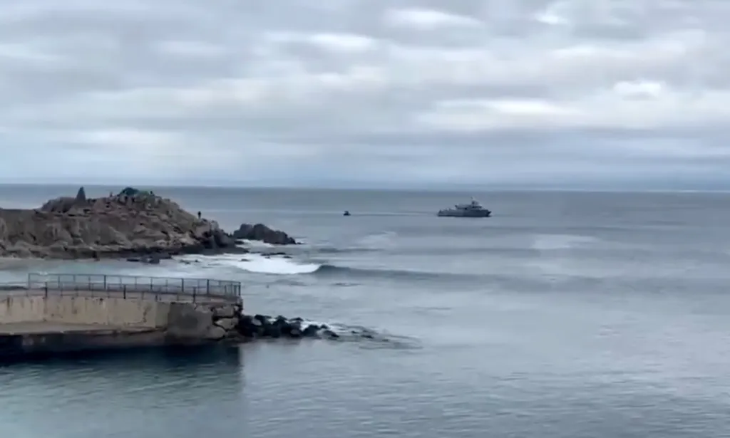 Rescue crews search for a missing swimmer in Monterey, California.