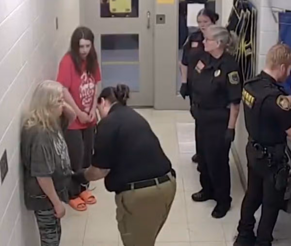 Christina Siders was seen wearing gray leggings and gray t-shirt while being searched in jail