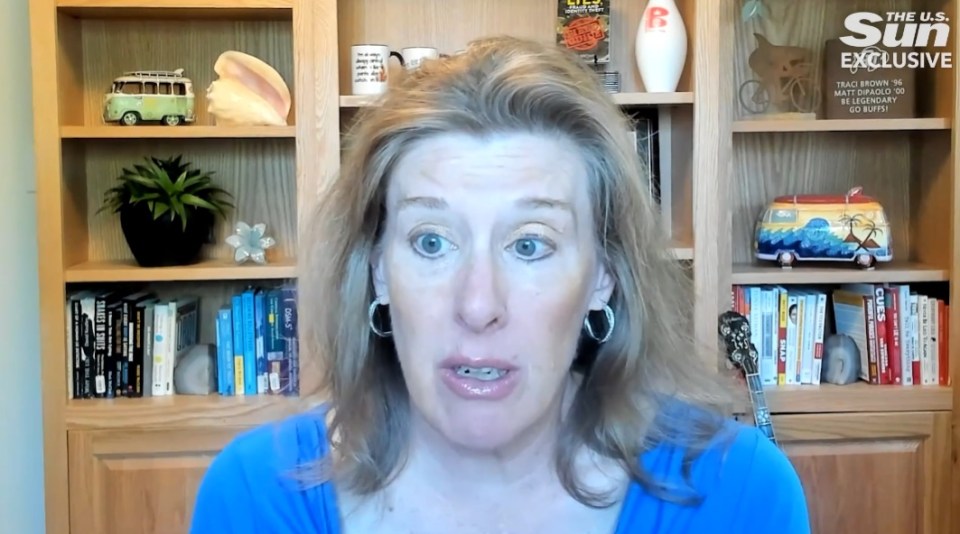 Body language expert Traci Brown speaking in front of a bookshelf.