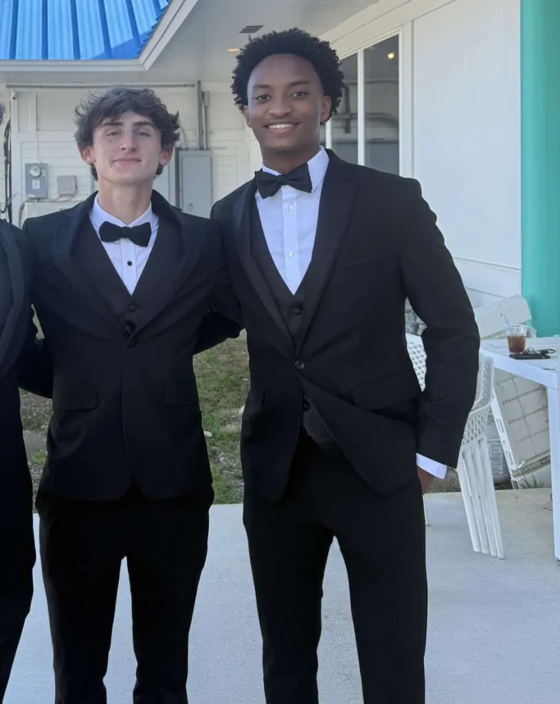 Warren Hudson (left) and Nolan Wells (right) in black suits with bow ties.