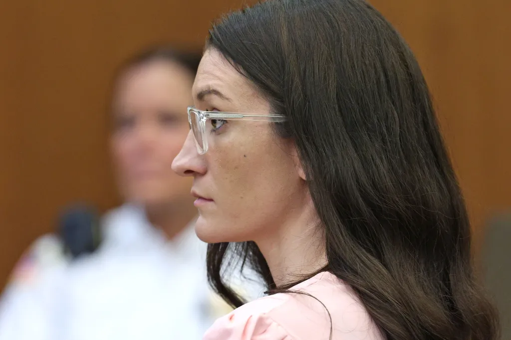 Lindsay Clancy listens to Dr. Jennifer Tufts on the witness stand