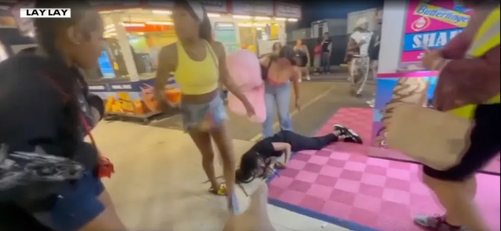 A person lies on the ground after being attacked during the brawl on Aug. 16, 2026.