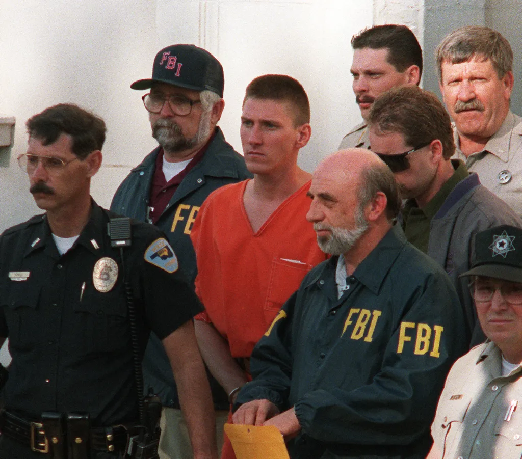 Timothy McVeigh (center) is led from the Noble County Courthouse by FBI agents in Perry, Oklahoma, on April 21, 1995.