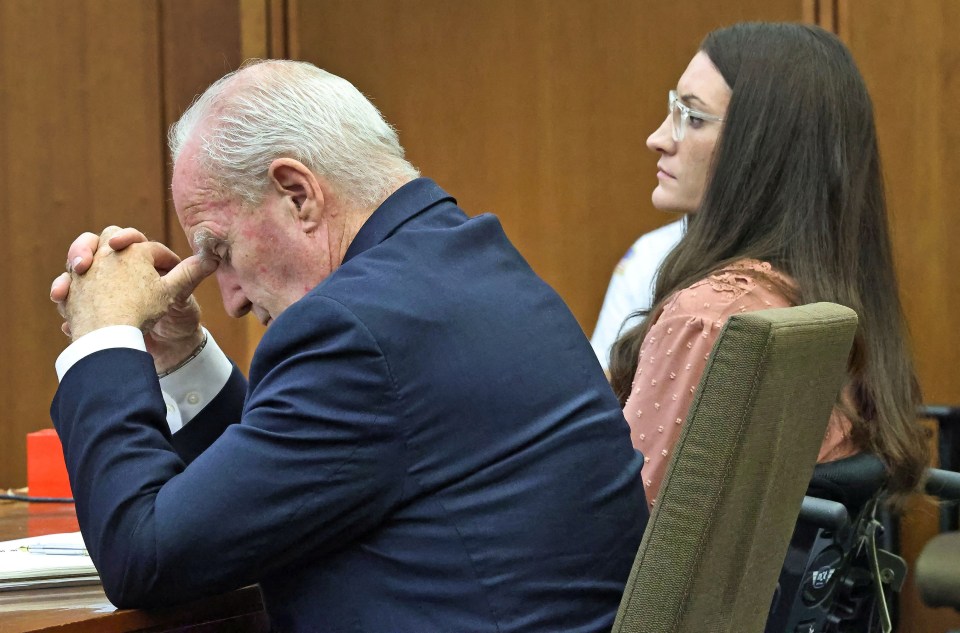 Defense attorney Kevin Reddington listens to testimony, with client Lindsay Clancy visible behind him.