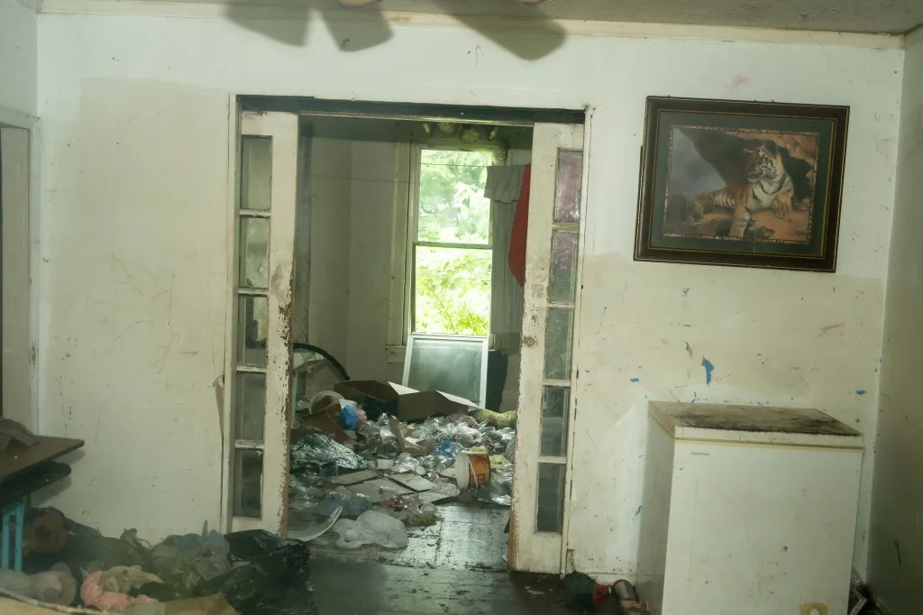 Interior view of the Sider’s home at 82 Ohmer St. in Hamden, Ohio, with garbage overflowing into a doorframe.