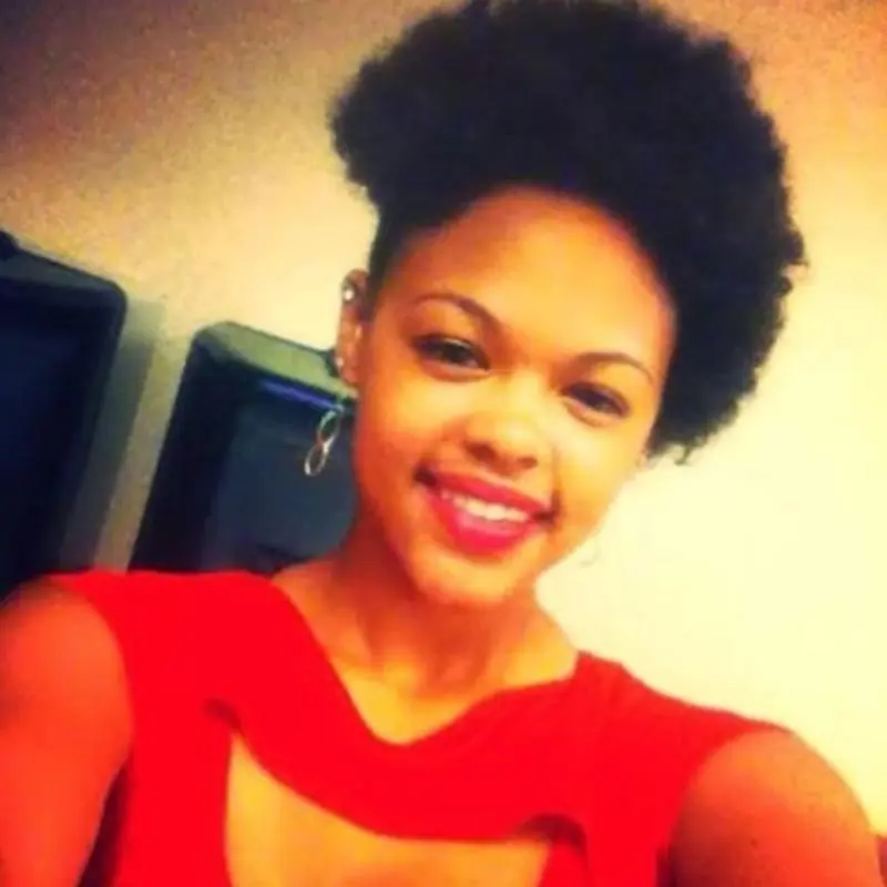 Tasia Fortune, a 29-year-old mother of four, smiles at the camera.